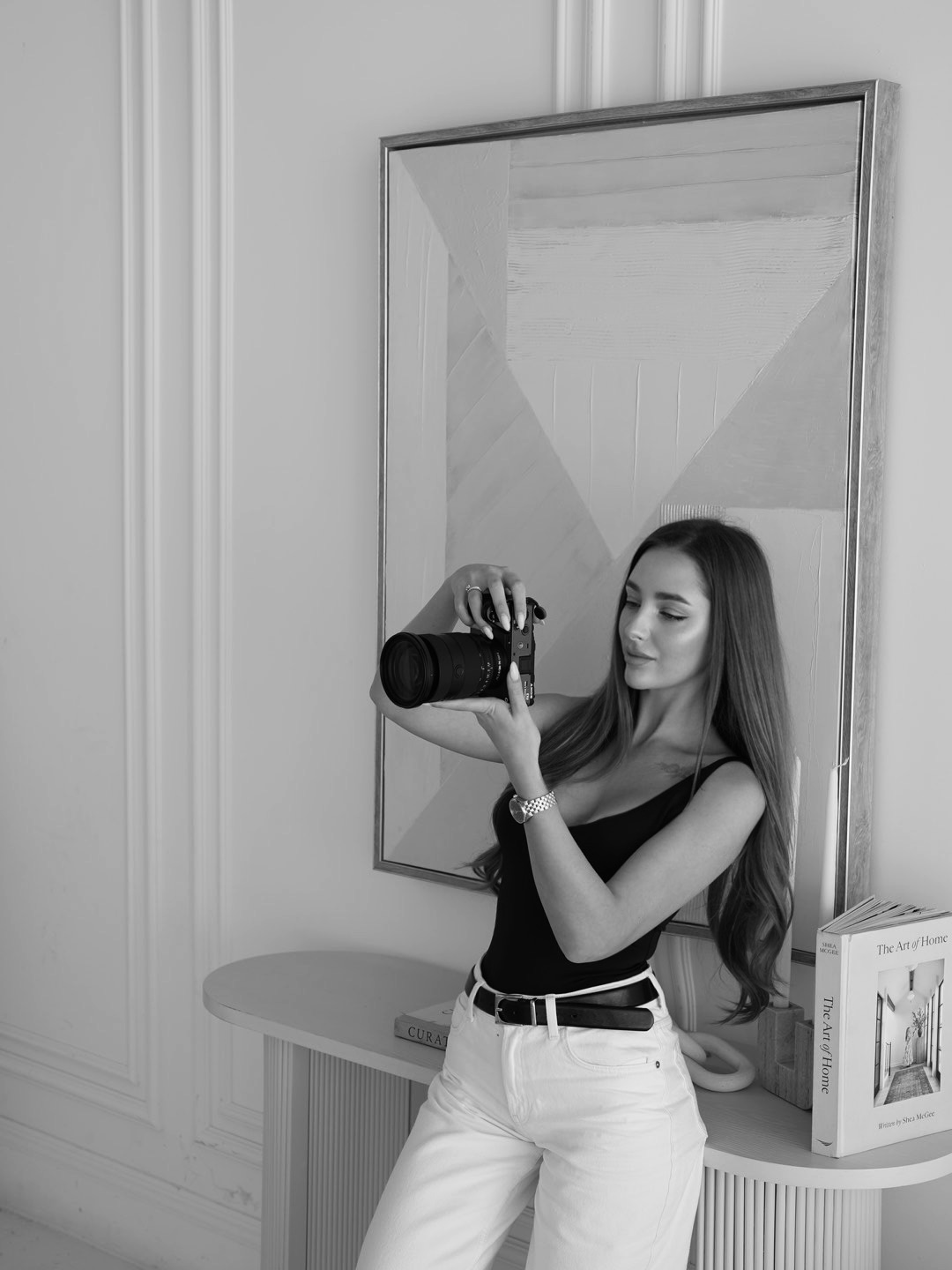Photographer holding a camera in an elegant interior